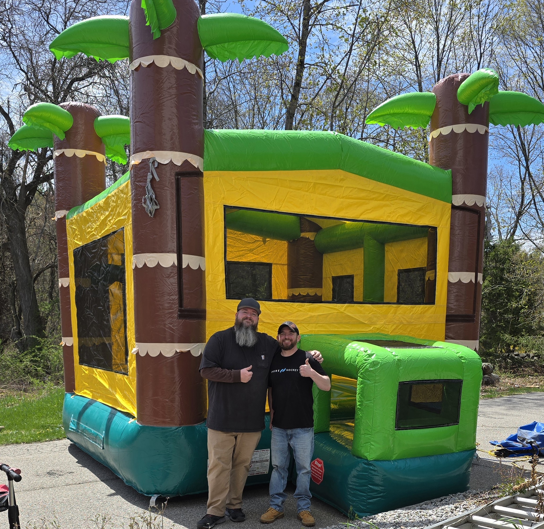 The Bearded Bouncer Guys with inflatable bounce house